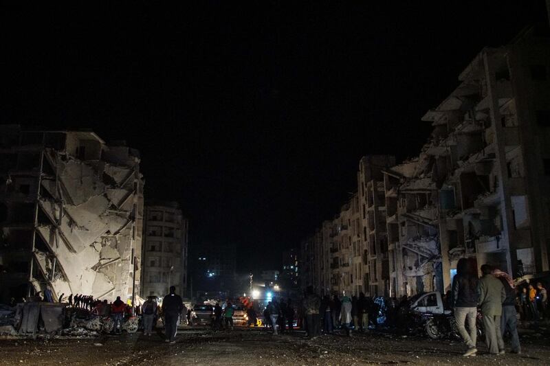 Emergency services and first aiders search for victims following an explosion in an area of the rebel-held city of Idlib, northwestern Syria. Yahya Nemah / EPA