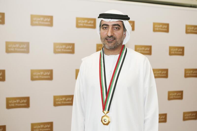 Dr. Mohammed Al Olama received a medal presented by Sheikh Mohammed bin Rashid, Vice President and Ruler of Dubai, during the UAE Pioneers Awards Ceremony. Sarah Dea / The National