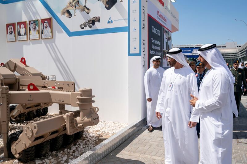 ABU DHABI, UNITED ARAB EMIRATES - February 20, 2019: HH Sheikh Mohamed bin Zayed Al Nahyan, Crown Prince of Abu Dhabi and Deputy Supreme Commander of the UAE Armed Forces (2nd R) visits Mahinra stand, during the 2019 International Defence Exhibition and Conference (IDEX), at Abu Dhabi National Exhibition Centre (ADNEC).
( Ryan Carter for the Ministry of Presidential Affairs )
---
