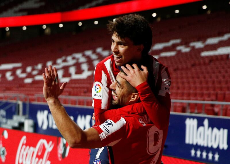 Atletico Madrid's Luis Suarez celebrates scoring their second goal with Joao Felix. Reuters