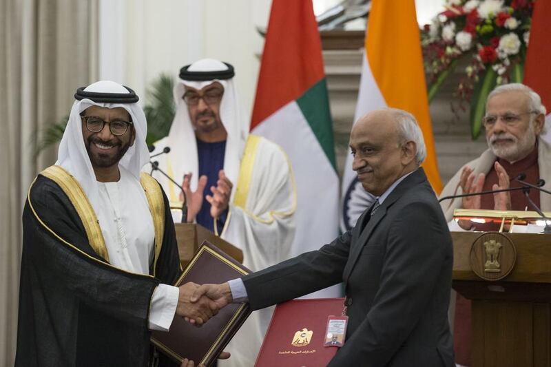 Sheikh Mohammed bin Zayed, Crown Prince of Abu Dhabi and Deputy Supreme Commander of the  Armed Forces and Narendra Modi Prime Minister of India witness the exchange of a memorandum of understanding between India and the UAE pertaining to the exploration of space. Seen exchanging on behalf of the UAE is Dr Khalifa Al Romaithi, Chairman of the UAE Space Agency. Ryan Carter / Crown Prince Court - Abu Dhabi