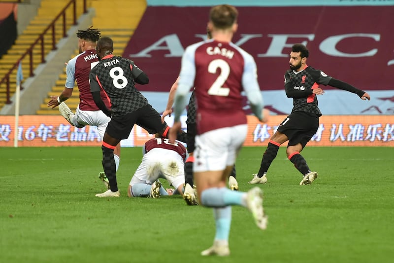 Liverpool's Mohamed Salah, right, scores his side's opening goal. AP