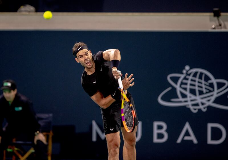 Rafael Nadal serves to Denis Shapovalov at the Mubadala World Tennis Championship. Victor Besa / The National