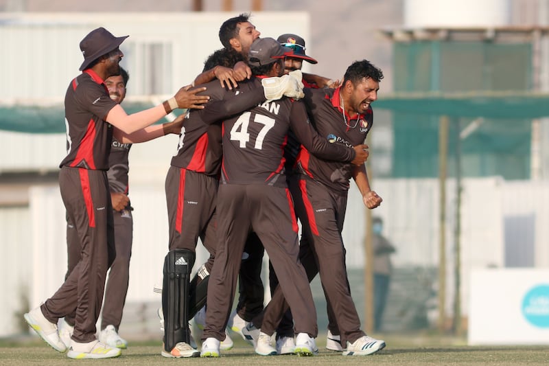 UAE players celebrate their win over Nepal in the T20 World Cup Qualifier at the Oman Cricket Academy in Muscat. All images Subas Humagain for The National