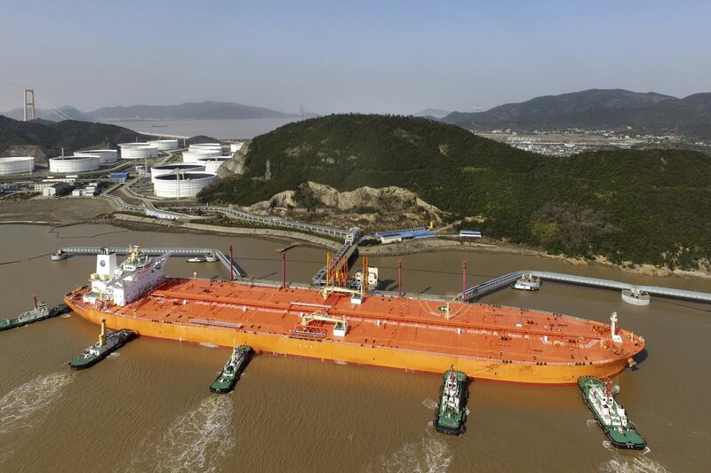 Tugboats dock the oil tanker "EAGLE VARNA" carrying imported crude oil at the Port of Zhoushan in Zhoushan city, east China's Zhejiang province, 4 July 2018. China has issued a second batch of crude oil import quotas for independent refiners and some trading companies with a total volume of 11.91 million tonnes, three trade sources said on Thursday, citing official documents. Of the 26 companies that received quotas, 21 were independent refiners, they said. The first batch of quotas for this year totaled 121.32 million tonnes and were issued to 44 companies in December.  (Imaginechina via AP Images)