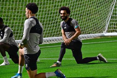 Liverpool's Egyptian midfielder Mohamed Salah (R) and English midfielder Curtis Jones take part in a training session at Qatar University stadium in the capital Doha on December 16, 2019, ahead of their December 18 FIFA Club World Cup football match against Mexico's Monterrey. / AFP / Giuseppe CACACE