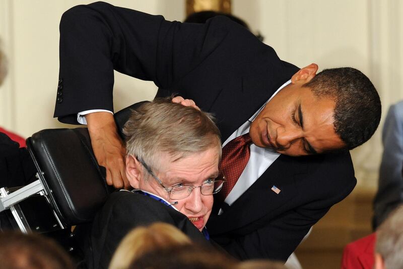 US President Barack Obama presents the Presidential Medal of Freedom to British theoretical physicist Stephen Hawking during a ceremony in the East Room at the White House on August 12, 2009. Jewel Samad / AFP