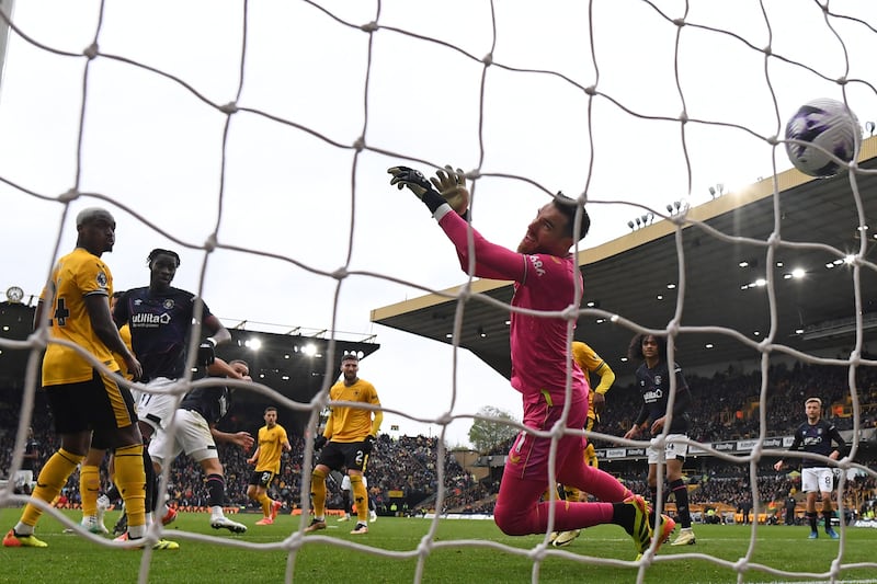 Luton Town's English striker Carlton Morris shoots past Wolverhampton Wanderers' goalkeeper Jose Sa. AFP