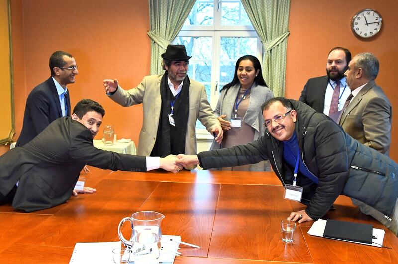 At left, Abdelqader al-Murtada and Saelem Mohammed Noman Al-Mughalles, representatives of the Ansar Allah delegation and at right, Askar Zaeil and Hadi al-Hayi representing the delegation of the Government of Yemen react at the negotiating table together with representatives from the office of the U.N. Special Envoy for Yemen and the International Red Cross Committee (ICRC) when lists of prisoners are exchanged, a first step to implement the agreement to release all prisoners by the two parties, during the ongoing peace talks on Yemen held at Johannesberg Castle, in Rimbo, near Stockholm, Sweden, December 11, 2018. TT News Agency/Claudio Bresciani via REUTERS  ATTENTION EDITORS - THIS IMAGE WAS PROVIDED BY A THIRD PARTY. SWEDEN OUT.