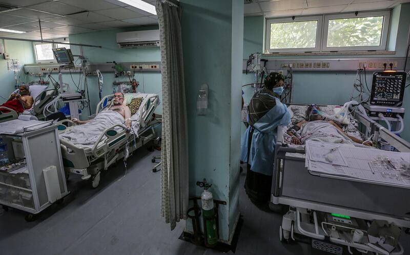 Palestinian patients with coronavirus in the intensive care unit at the European Hospital, east of Rafah town, southern Gaza strip, 30 November 2020. The European Hospital, which has been classified as the Epidemiology Hospital since the start of the coronavirus in the Gaza Strip on 25 August 2020, has 334 infected cases under clinical care including 109 severe and critical cases. The production capacity of oxygen is 2,200 liters per minute, and there has become a large deficit after the increasing number of infections with Coronavirus.  EPA/MOHAMMED SABER