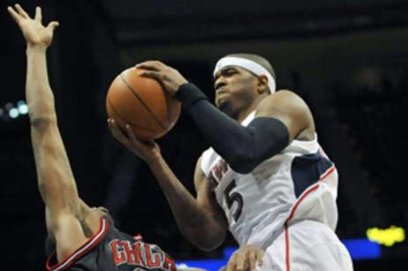 The Atlanta Hawks forward Josh Smith tries to go past the Chicago Buls forward Tyrus Thomas.