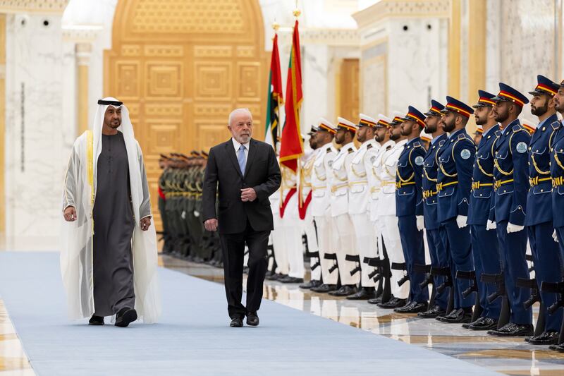 The two presidents inspect the guard of honour at Qasr Al Watan in Abu Dhabi