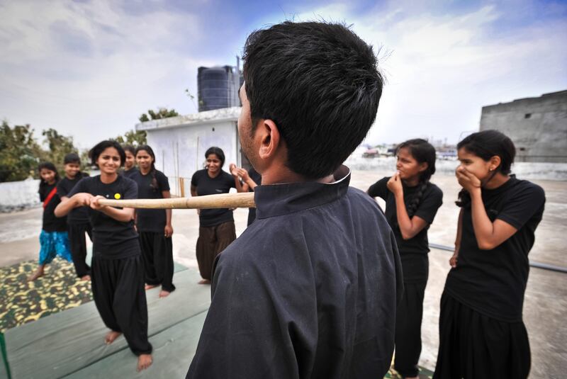 Pooja Vishwakarma, 18, a captain in the Red Brigade, during martial arts training in Lucknow. The Red Brigade was formed in November 2010 to fight back against a growing number of sexual attacks on women in the Madiyav area of the city of Lucknow, in Uttar Pradesh state, India.
The group of young women wear distinctive red and black salwar kameez. Most have been victims of sexual assault and have resolved that they will take no more. They take direct action against their tormentors and now when a local man steps out of line, he can expect a visit from the Red Brigade and a thrashing.