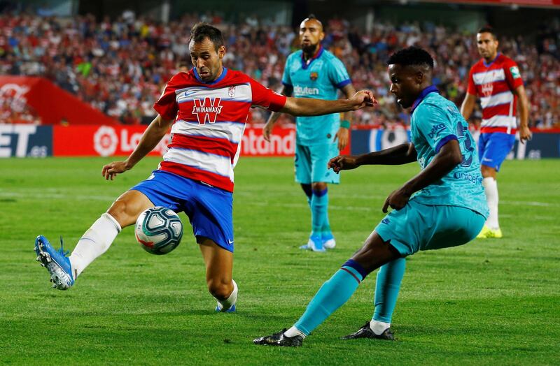 Granada's Victor Diaz in action with Barcelona's Ansu Fati. Reuters