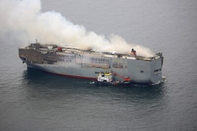 Smoke rises from the burning cargo ship, Fremantle Highway, off the Netherlands, on July 28.  Dutch Coastguard / Reuters