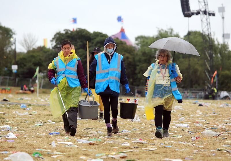 It's a major operation to de-litter the Somerset dairy farm after 200,000 people attended the festival. EPA