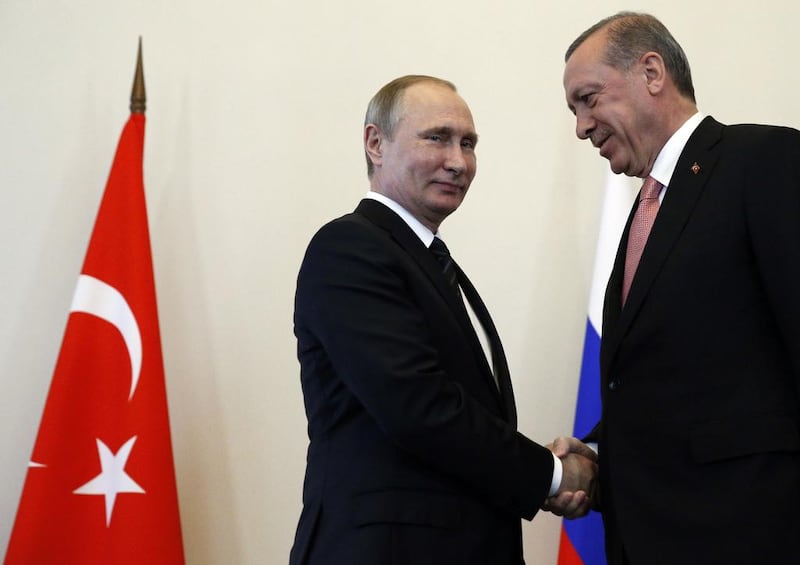 Russian president Vladimir Putin, left, welcomes Turkish president Recep Tayyip Erdogan in the Konstantin palace outside St Petersburg, on August 9, 2016. Alexander Zemlianichenko/AP Photo