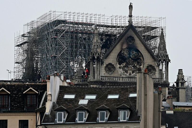 The landmark Notre-Dame Cathedral in Paris the day after a fire destroyed its spire, April 16, 2019.  AFP