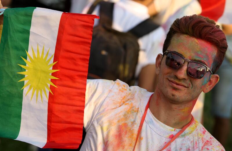 An Iraqi Kurd holds a Kurdish flag during an event to urge people to vote in the upcoming independence referendum in Arbil, the capital of the autonomous Kurdish region of northern Iraq, on September 15, 2017.
Iraqi Kurdish lawmakers voted to hold an independence referendum set in motion by regional president Massud Barzani, who has kept open the option of postponing it under American pressure. / AFP PHOTO / SAFIN HAMED