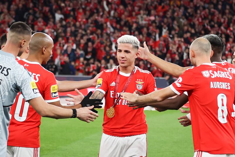 Benfica midfielder Enzo Fernandez is greeted by is teammates after receiving a medal of honor after winning the Qatar World Cup with Argentina. EPA