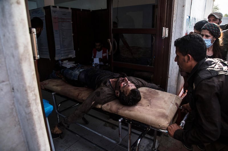 A man wounded in Turkish shelling is brought to Tal Tamr hospital in north Syria. Syrian government troops moved into towns and villages in northern Syria on Monday, setting up a potential clash with Turkish-led forces advancing in the area as long-standing alliances in the region begin to shift or crumble following the pullback of U.S. forces. AP Photo