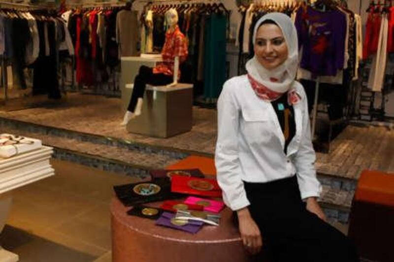 Zeina Abou-Chaaban with some of the Palestyle designs, whose sale give Palestinian women in refugee camps an income.