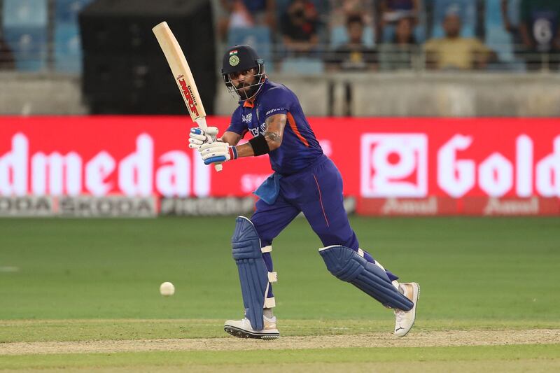 Virat Kohli hits a boundary at the Dubai International Stadium. AFP