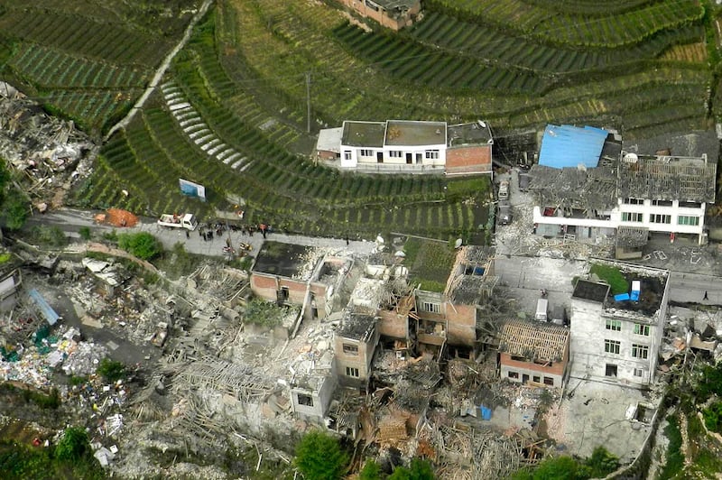 This aerial photo released by China's Xinhua news agency shows destroyed houses after a powerful earthquake hit Taiping town of Lushan County in Ya'an City, southwest China's Sichuan Province, Saturday, April 20, 2013. The powerful earthquake jolted Sichuan province Saturday near where a devastating quake struck five years ago. (AP Photo/Xinhua, Liu Yinghua) NO SALES *** Local Caption ***  China Earthquake.JPEG-0953f.jpg