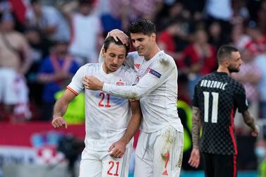 Spain's Mikel Oyarzabal, left, celebrates with Alvaro Morata after scoring his side's fifth goal during the Euro 2020 soccer championship round of 16 match between Croatia and Spain at Parken stadium in Copenhagen, Denmark, Monday, June 28, 2021. (AP Photo/Martin Meissner, Pool)