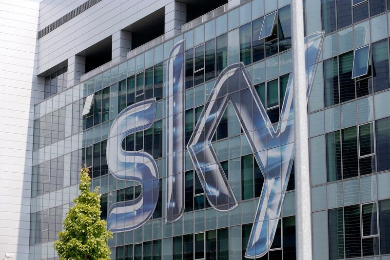 FILE - This Friday, July 25, 2014, file photo shows a view of the headquarters of the Italian Sky television broadcaster in Milan, Italy. Media mogul Rupert Murdoch's 21st Century Fox has increased its bid to take full control of Sky in a prolonged battle with Comcast for the lucrative pay TV service. Fox Wednesday, July 11, 2018 increased its bid to 14 pounds ($18.58) a share as it seeks the 61 percent of Sky not already under its control. (AP Photo/Luca Bruno, File)