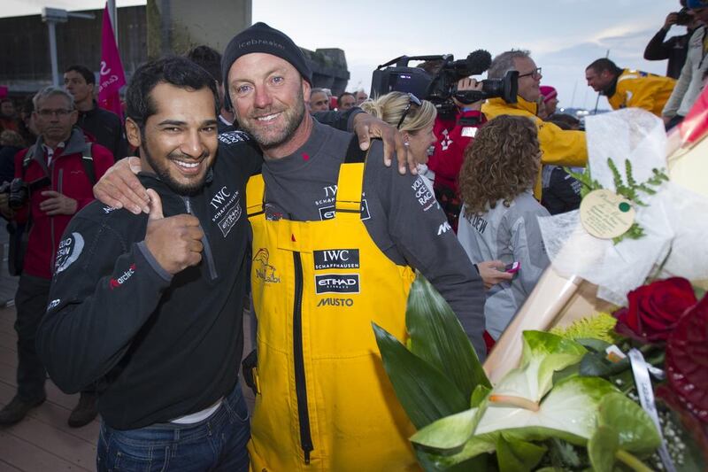 Emirati crew member Adil Khalid, left, and skipper Ian Walker celebrate victory in Lorient, France. Courtesy Ian Roman / Abu Dhabi Ocean Racing / Getty Images 