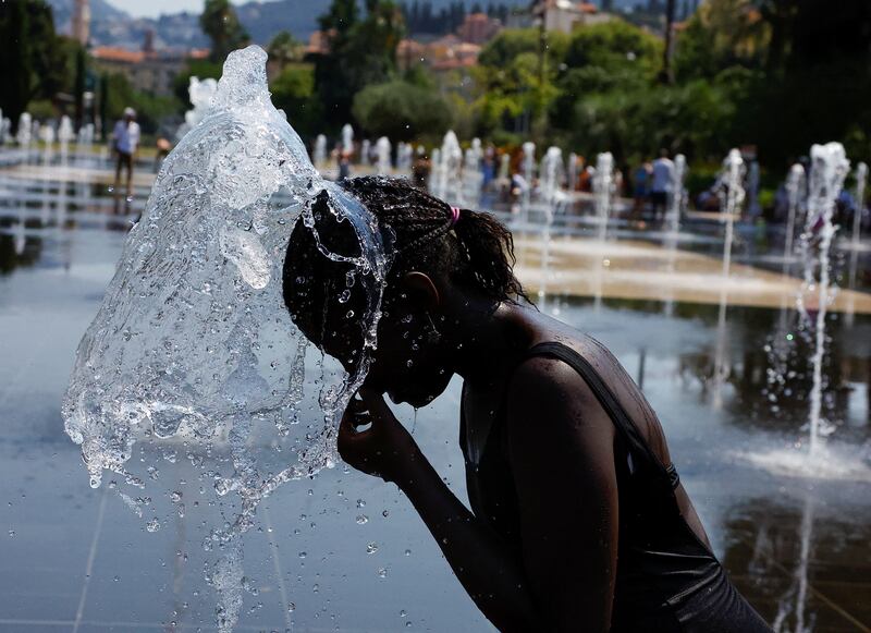 A girl cools off in Nice's urban park. Reuters