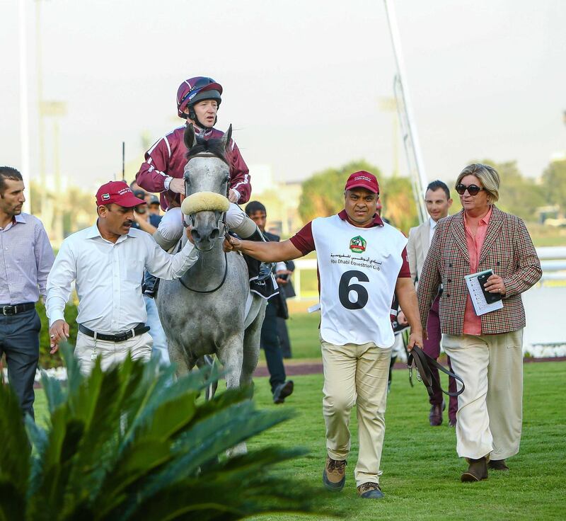 Jaci Wickham, extreme right, walks along with her winner Marwa W’Rsan with Sam Hitchcott on the saddle. Courtesy Abu Dhabi Equestrian Club