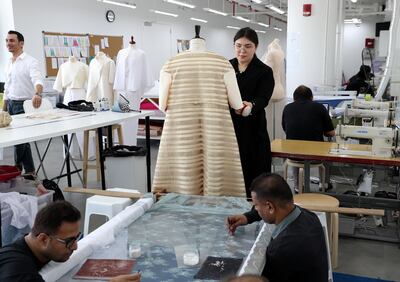 Dubai, United Arab Emirates - August 23rd, 2017: A feature on fashion designer Rami Al Ali & Karashash Nurakhmet a ESMOD fashion school intern. Karashash is designing clothes which will then be sold, and Rami Al Ali is helping lend his industry knowledge. Wednesday, August 23rd, 2017 at The Design District, Dubai. Chris Whiteoak / The National