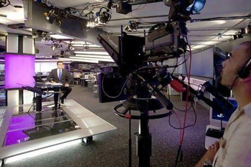 News presenter Soheb Cherair, left, at the Al Arabiya studio in Dubai Media City. Two more news channels will be entering the crowded sector this year, joining Al Jazeera and Al Arabiya. Jaime Puebla / The National