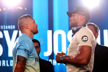 LONDON, ENGLAND - JUNE 29: Anthony Joshua of Great Britain (R) and Oleksanr Usyk of Ukrain face off during the Oleksandr Usyk v Anthony Joshua 2 Press Conference at on June 29, 2022 in London, England. (Photo by Alex Pantling / Getty Images)