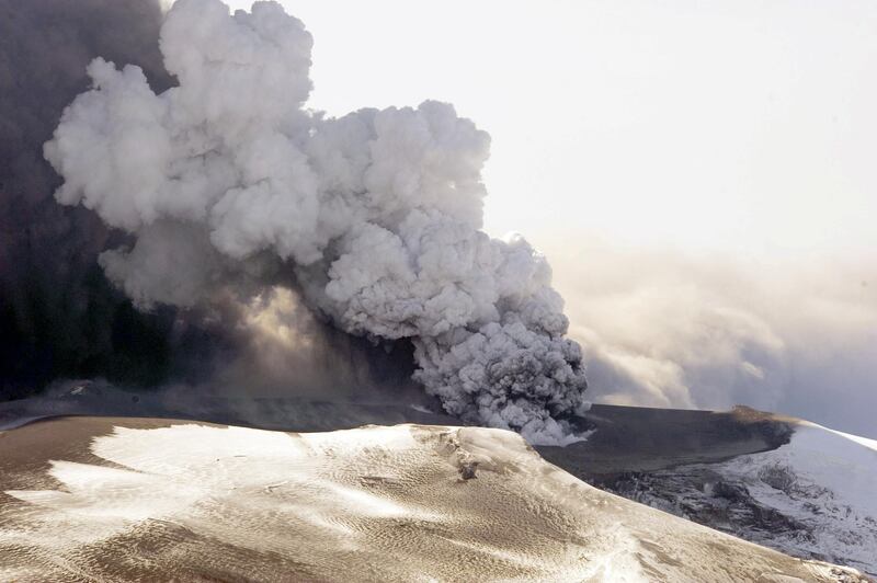 This aerial view shows the Eyjafjallajokull volcano billowing smoke and ash during an eruption on April 17, 2010. Winds blowing a massive volcanic ash cloud from Iceland could keep lashing Europe until the middle of next week, experts said Saturday, amid hints that the eruption could soon start tapering off.  Millions of people faced worsening travel chaos Sunday as a volcanic ash cloud from Iceland moved further south and east, forcing European countries to extend flight bans into next week.   AFP PHOTO / HALLDOR KOLBEINS (Photo by HALLDOR KOLBEINS / AFP)