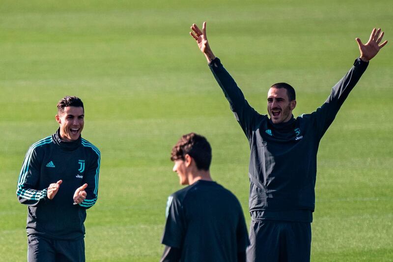 Cristiano Ronaldo (L) and Bonucci having fun at training.  AFP