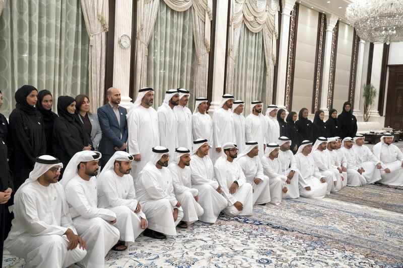 ABU DHABI, UNITED ARAB EMIRATES - June 04, 2018: HH Sheikh Mohamed bin Zayed Al Nahyan Crown Prince of Abu Dhabi Deputy Supreme Commander of the UAE Armed Forces (2nd row, 10th R), stands for a photograph with UAE Space and Astronomy sector employees during an iftar reception at Al Bateen Palace. 

( Hamad Al Kaabi / Crown Prince Court - Abu Dhabi )
---