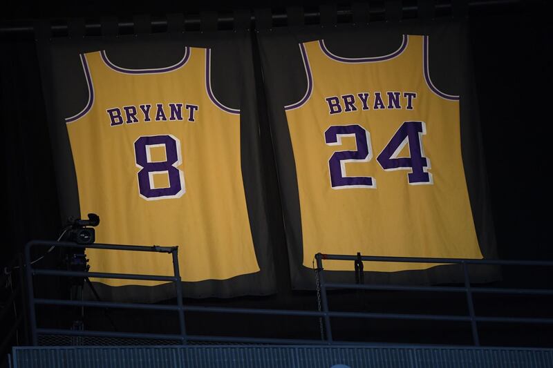 Lights illuminate the jerseys in tribute of former Los Angeles Laker shooting guard, NBA star, Kobe Bryant during the 62nd Annual Grammy Awards on January 26. AFP