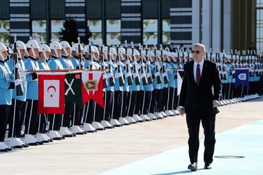 Turkey's President Recep Tayyip Erdogan, reviews an honour guard prior to a welcome ceremony for Ukraine's President Vladimir Zelenskiy, at the Presidential Palace in Ankara, Turkey, Wednesday, August 7, 2019. AP