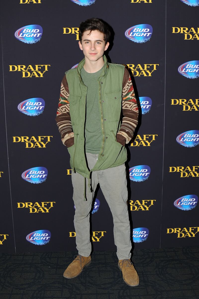 Timothee Chalamet, in a khaki parka with knitted sleeves, attends the premiere of 'Draft Day' in New York, US, in April 2014. Sipa USA