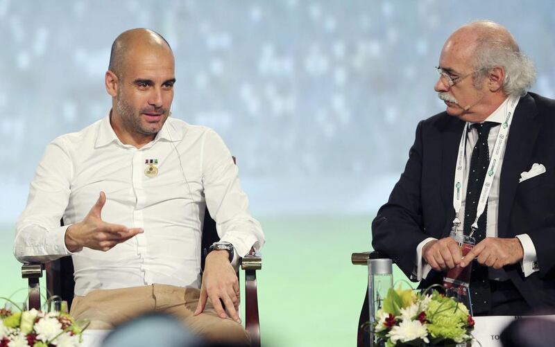 Bayern Munich head coach Pep Guardiola, left, says he wants the ability to make more than three substitutions per match. Mohammed Omar / Reuters