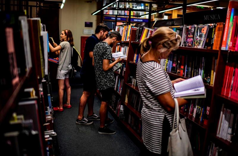 Customers browse through the  books in the "El Ateneo Grand Splendid" bookstore. AFP