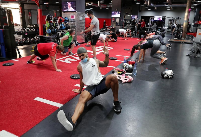 DUBAI, UNITED ARAB EMIRATES , August 10 – 2020 :- Participants during the daily ultimate training session at the UFC Gym in Murjan 6 in Jumeirah Beach Residence in Dubai. They are taking part in the 90 minutes MMA Mash up. (Pawan Singh / The National) For News/Online/Instagram. Story by Nick Webster
