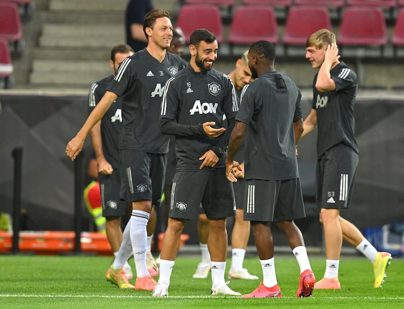 Manchester United players warm up during a training session ahead of the Europa League quarter-final match against FC Copenhagen in Cologne, Germany. Getty Images