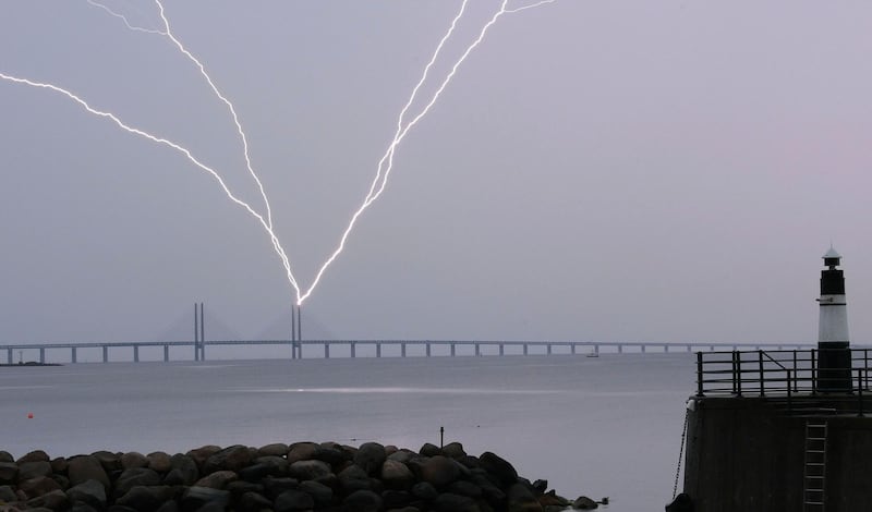 Lightning strikes the Oresund Bridge between Sweden and Denmark, during a thunderstorm, seen from Malmo, Sweden.  AFP