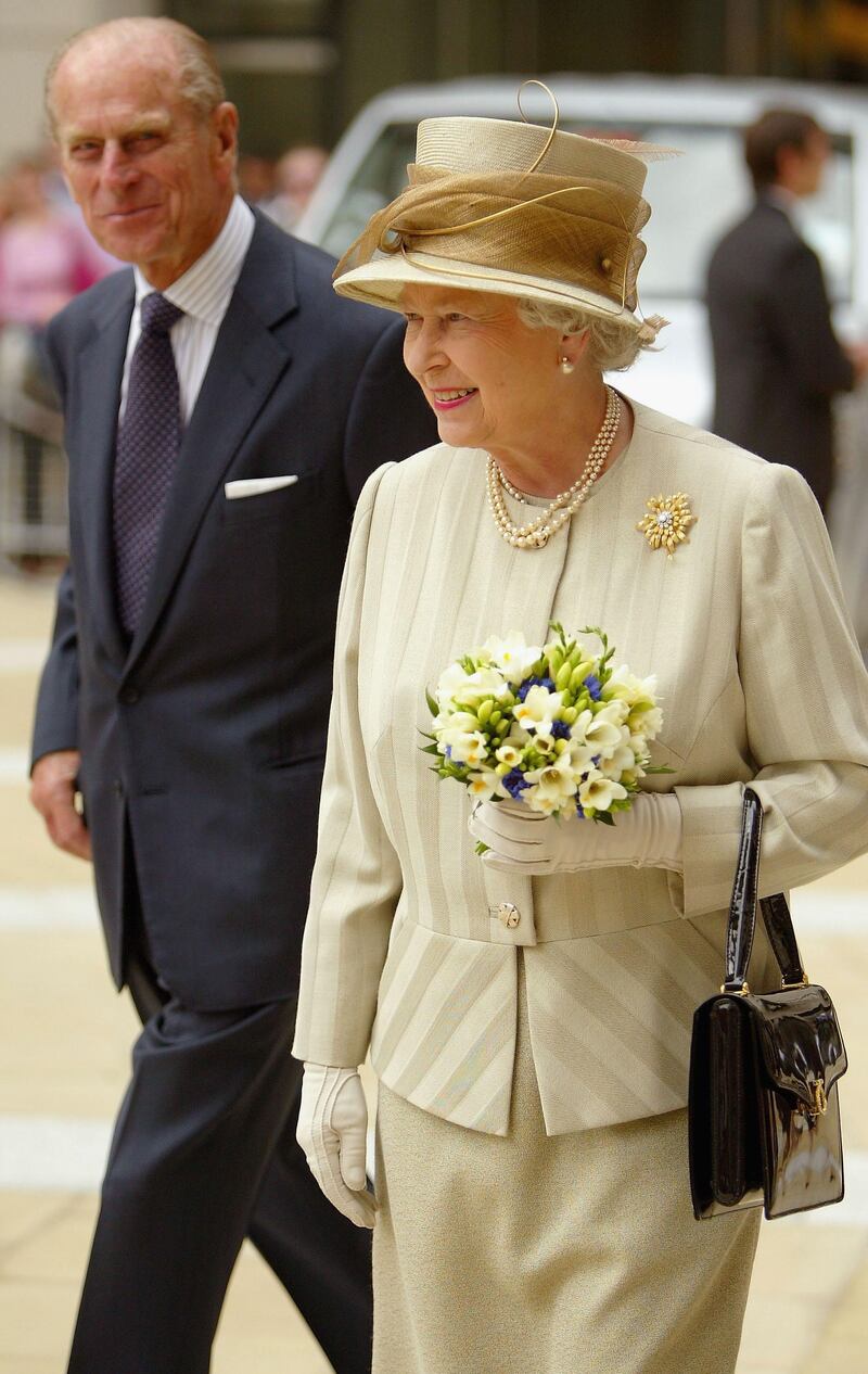LONDON - JULY 27:  Her Majesty Queen Elizabeth II leaves with HRH Prince Phillip after officially opening the new Stock Exchange building at Paternoster Square, on July 27, 2004 in London. The exchange has moved from the Old Broad Street site to a new city location.  (Photo by Bruno Vincent/Getty Images)