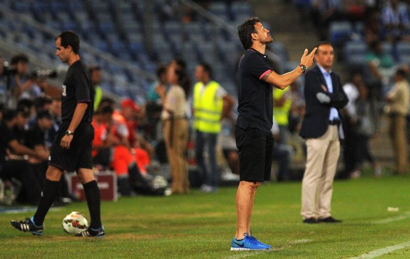 Barcelona manager Luis Enrique reacts during his side's 1-0 friendly victory over Recreativo de Huelva on Saturday. The match earned Barca the Colombino Trophy, which Huelva host a tournament to award every year commemorating their status as Spain's oldest club. Cristina Quicler / AFP / July 19, 2014