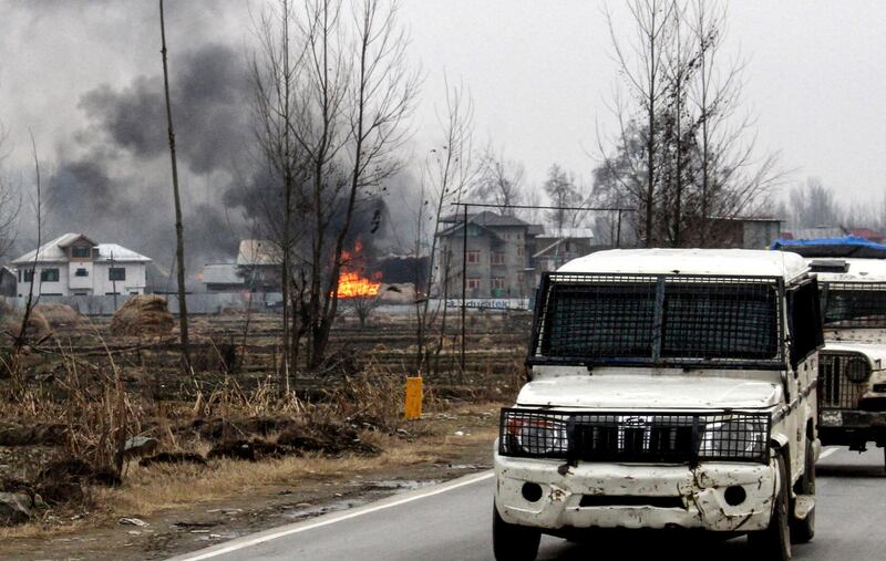 A house in which militants are suspected to have sheltered is in flames after a gunfight happened between rebels and security forces that killed 4 soldiers, in South Kashmir's Pulwama district, some 10 km away from the spot of recent suicide bombing, on February 18, 2019. At least four soldiers died on February 18 in a fierce gunfight with rebels in Indian-administered Kashmir just four days after a suicide bomber killed 41 paramilitaries in the troubled territory, officials said. One soldier and one civilian were also critically wounded in the shootout as troops launched a search operation in Pulwama district where the suicide bomber struck on February 14. / AFP / HABIB NAQASH
